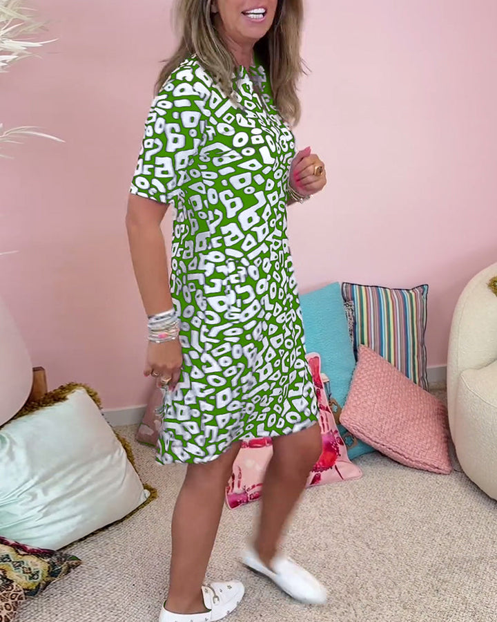 Viaro   | Printed dress with V-neck and pockets