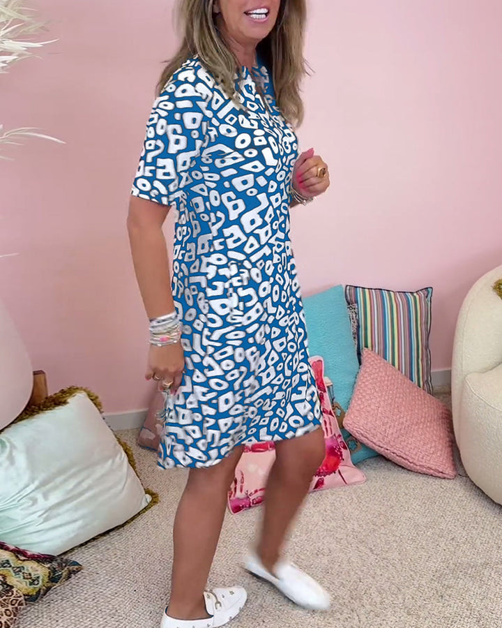 Viaro   | Printed dress with V-neck and pockets