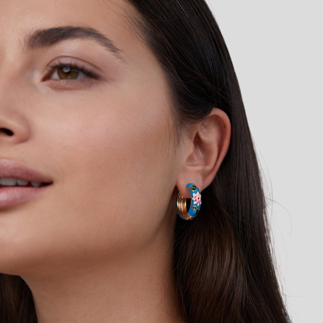 Golden hoop earrings with flower