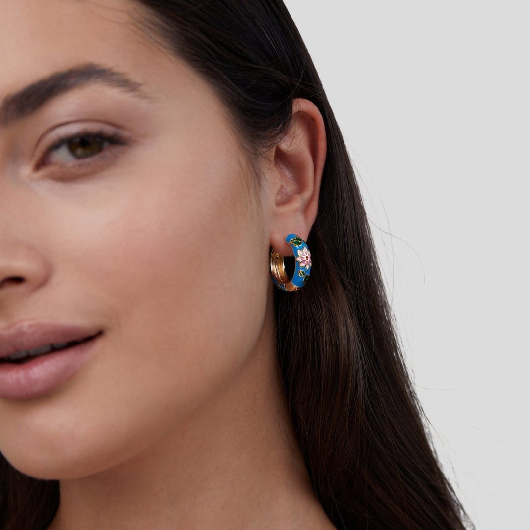 Golden hoop earrings with flower